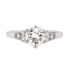 a 0.95 Carat Old Cut Diamond Engagement Ring with 6 smaller diamonds set in Platinum