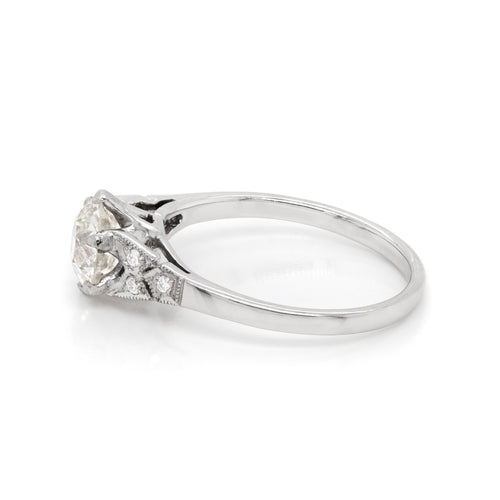 a 0.95 Carat Old Cut Diamond Engagement Ring with 6 smaller diamonds set in Platinum
