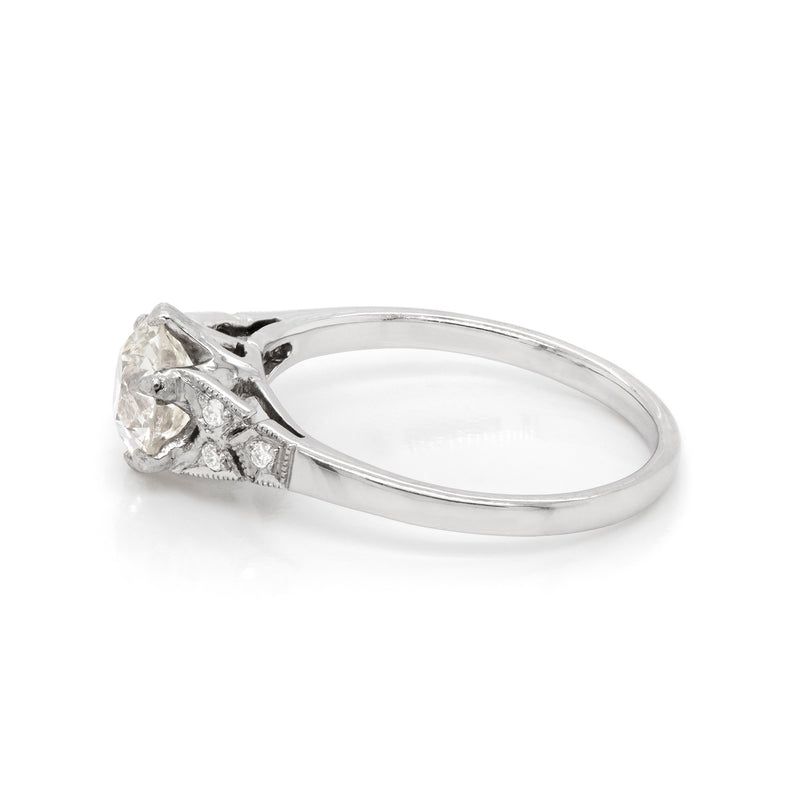 a 0.95 Carat Old Cut Diamond Engagement Ring with 6 smaller diamonds set in Platinum