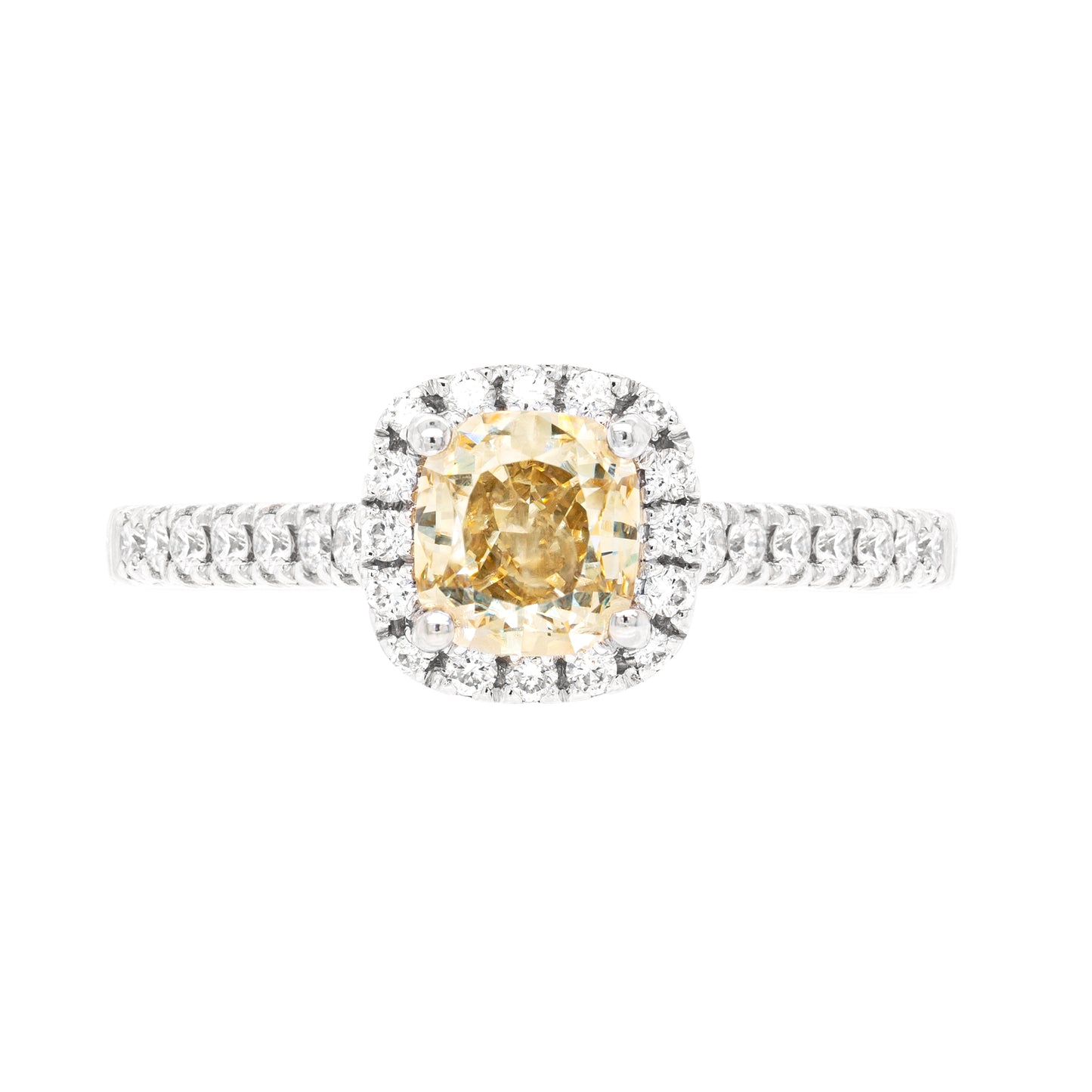 A champagne diamond engagement ring with white round brilliant cut diamonds set in a platinum band.