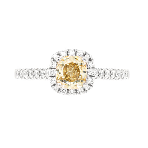 A champagne diamond engagement ring with white round brilliant cut diamonds set in a platinum band.