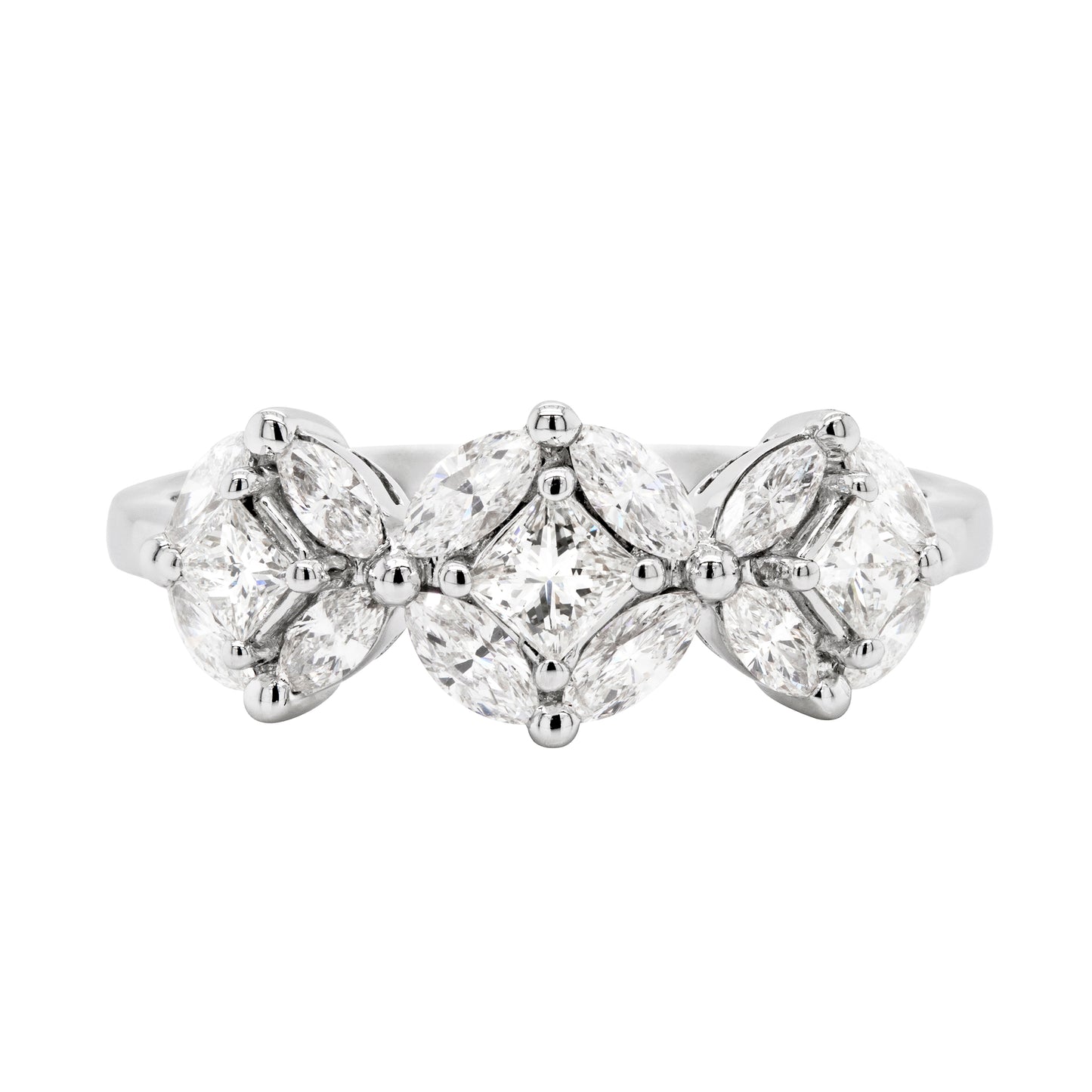 An 18 carat white gold trilogy diamond cluster engagement ring with three circular diamond clusters and a princess cut diamond in the center, set in a white gold band.