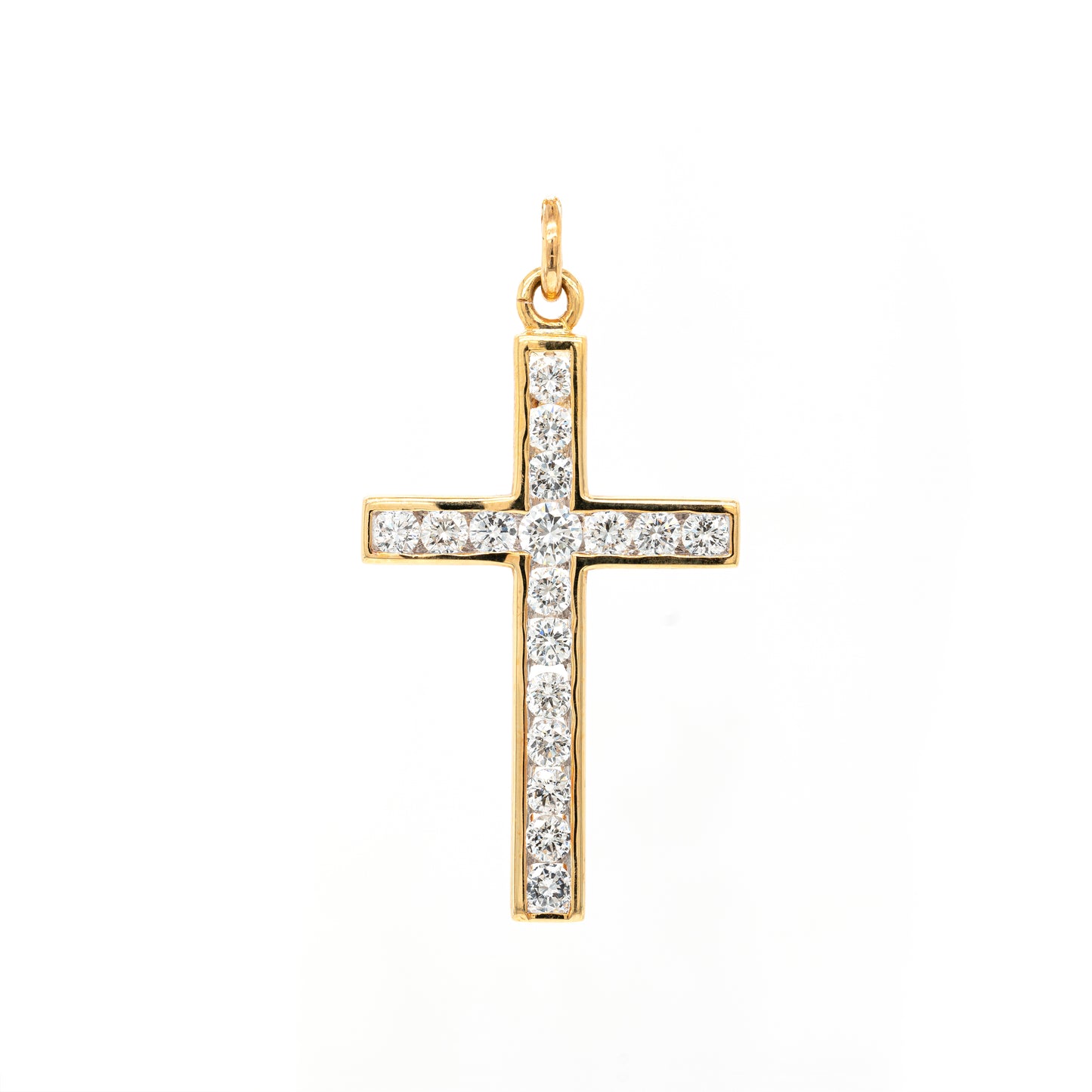 An 18 carat yellow gold diamond cross pendant with multiple round brilliant cut diamonds set within it.