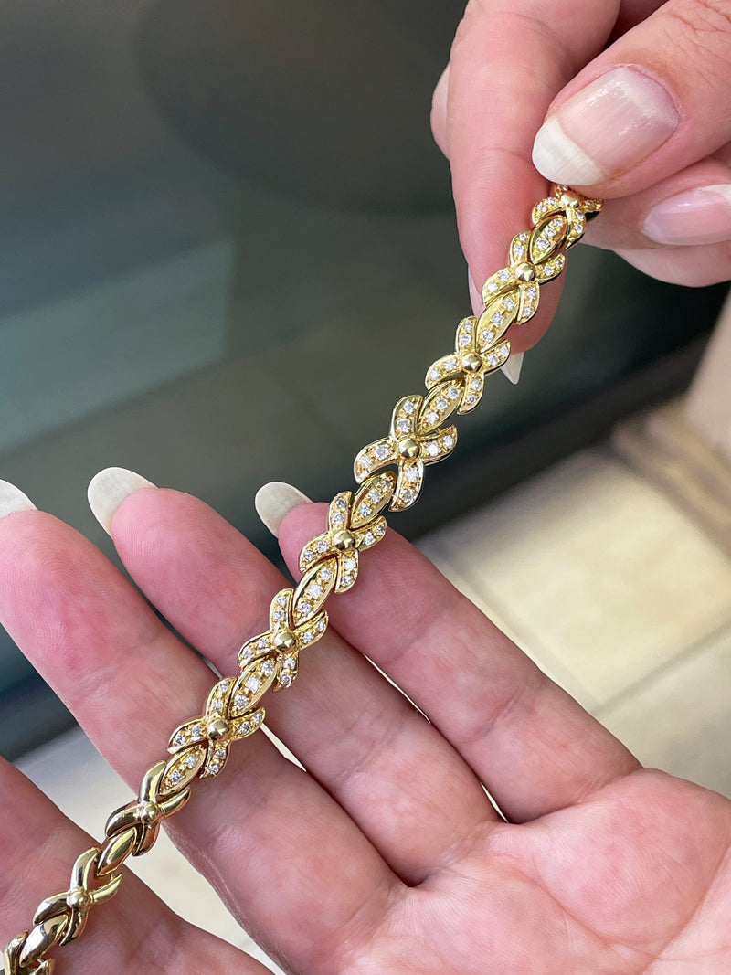 18ct yellow gold bracelet with 1.25ct diamonds set in alternating ‘X’ and bar links.