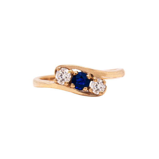 Blue Sapphire and Diamond Three-Stone 14 Carat Yellow Gold Crossover Engagement Ring