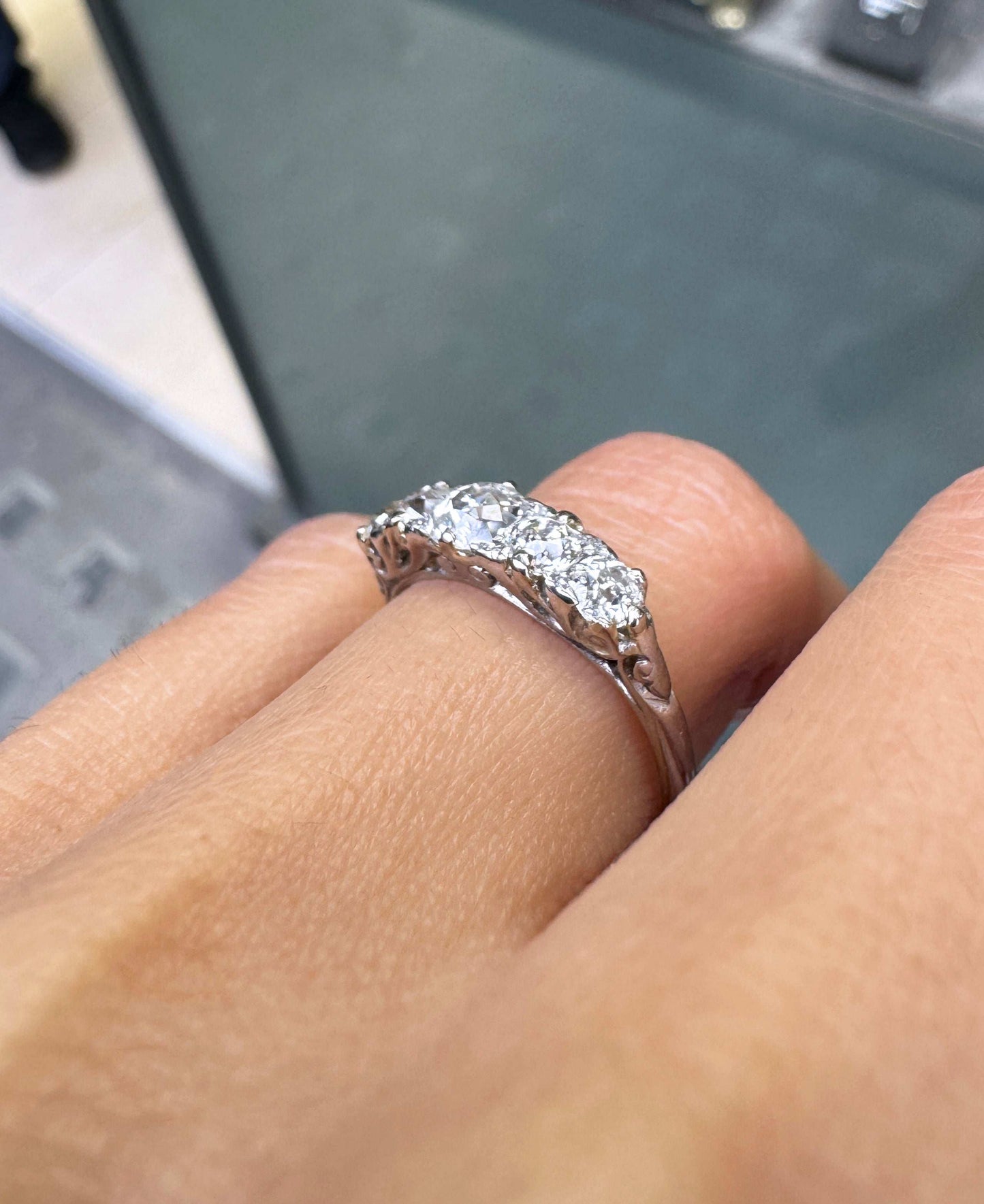 lady wearing Antique Five Stone Old Cut Diamond and Platinum Ring, circa 1900 close up