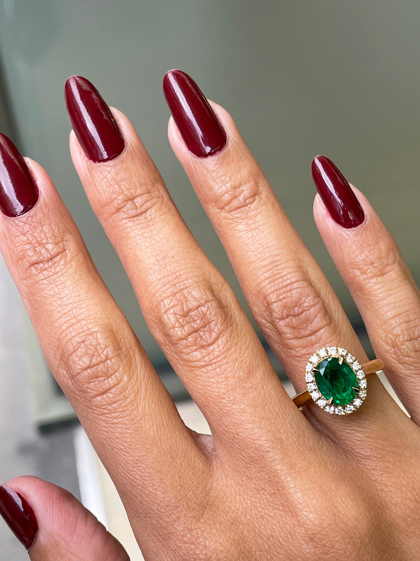 1.85 Carat Emerald and Diamond 18 Carat Yellow Gold Cluster Engagement Ring