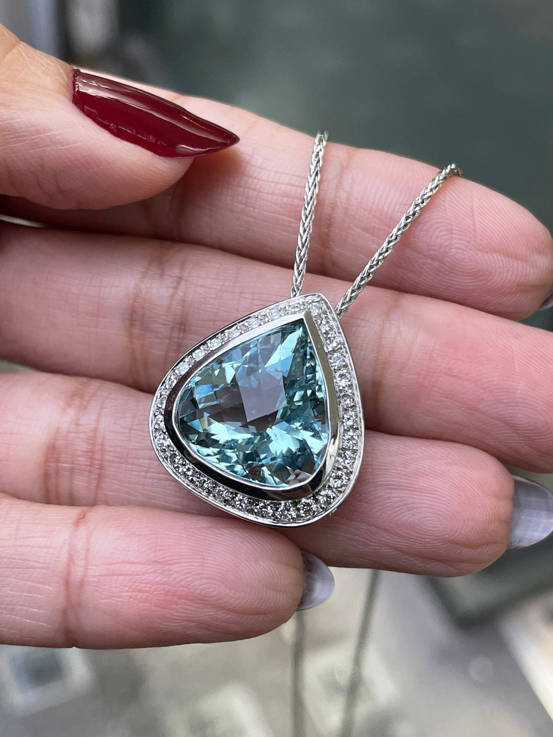 Pear Shape Aquamarine and Diamond Halo 18 Carat White Gold Pendant and Chain