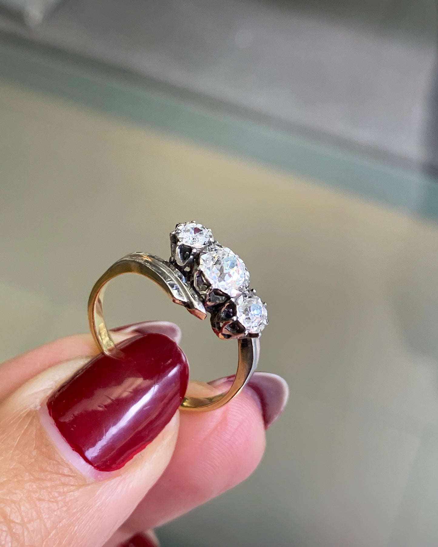 Old Cut Three-Stone Twist 18 Carat Gold and Platinum Ring, Circa 1920s