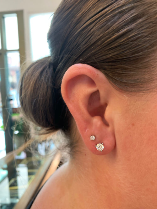 lady wearing Roberto Coin Cento Collection Diamond 18 Carat Gold Stud Earrings