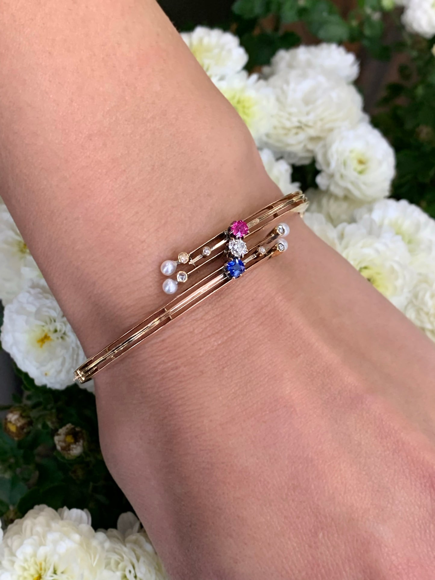 Edwardian 9 Carat Rose Gold Diamond, Sapphire, Ruby and Pearl Bangle, Circa 1900