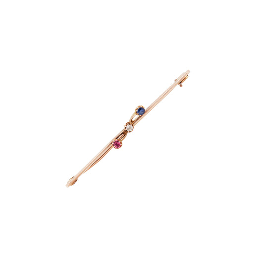 A delicate antique diamond, sapphire & ruby 9 carat rose gold bar brooch C.1910
