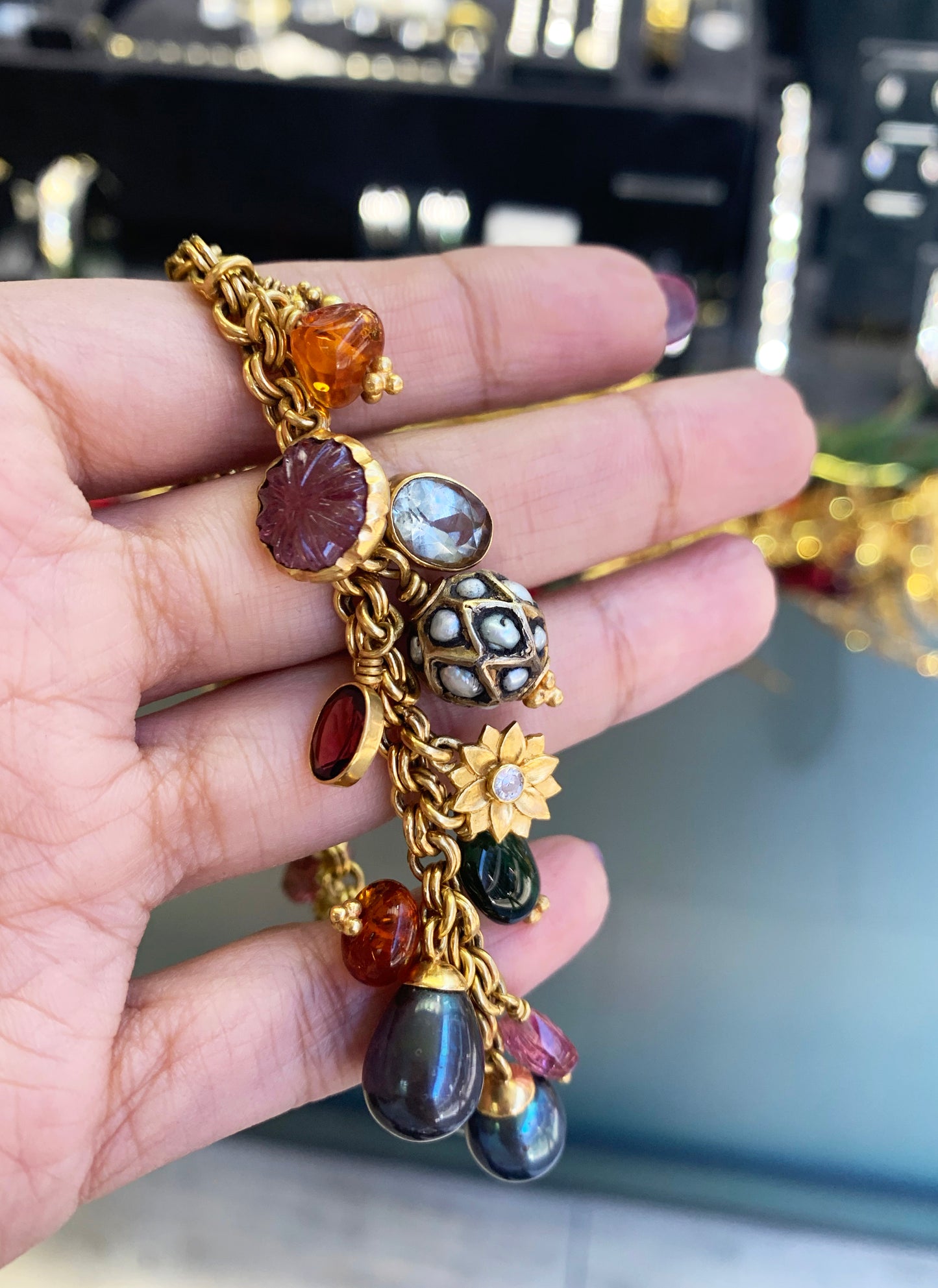 21 Carat Yellow Gold Multi-Gemstone Charm Bracelet
