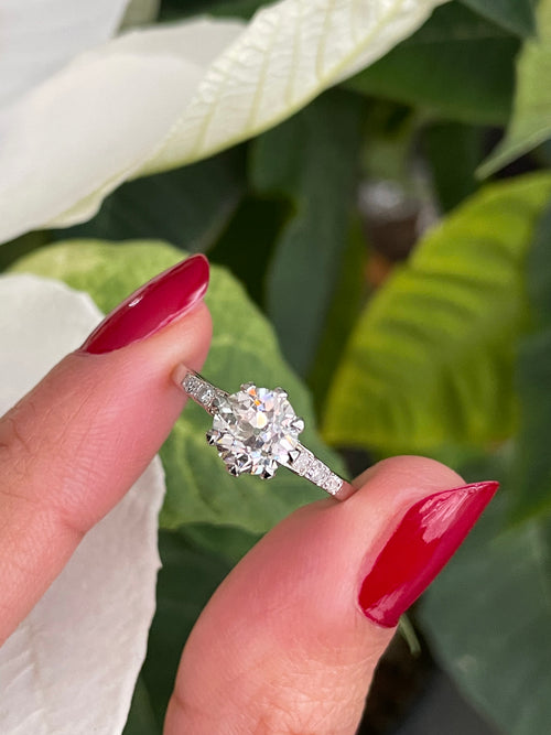 lady holding antique 1920's engagement ring