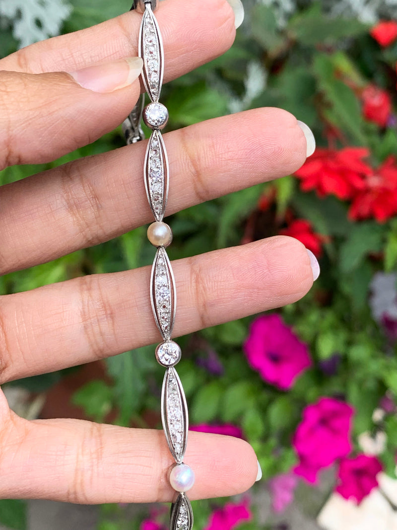 person holding French Pearl and Diamond Platinum Bracelet, Circa 1910