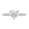 A heart-shaped diamond engagement ring with smaller round brilliant cut diamonds set in a platinum band.