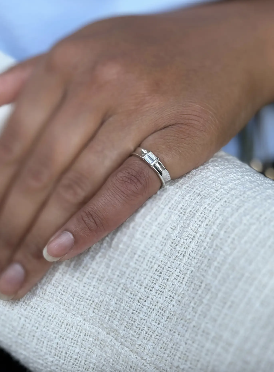 The wonderful tiffany & co piece features 2 fine quality baguette cut diamonds, weighing a total of approximately 0.30ct combined, channel set in an open back setting, at the centre of a high polish 18 carat white gold band.