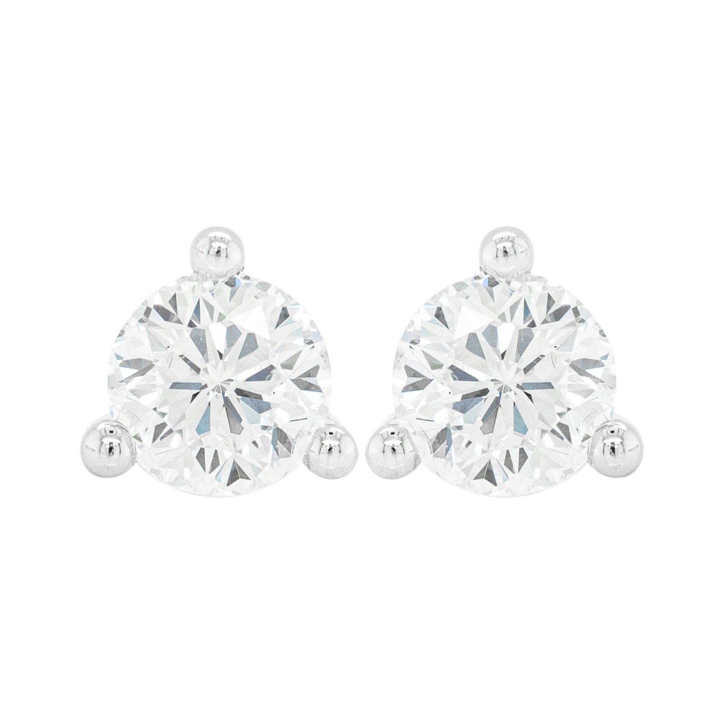 A pair of 18 carat white gold stud earrings with a clear, heart-shaped butterfly back and a central diamond.