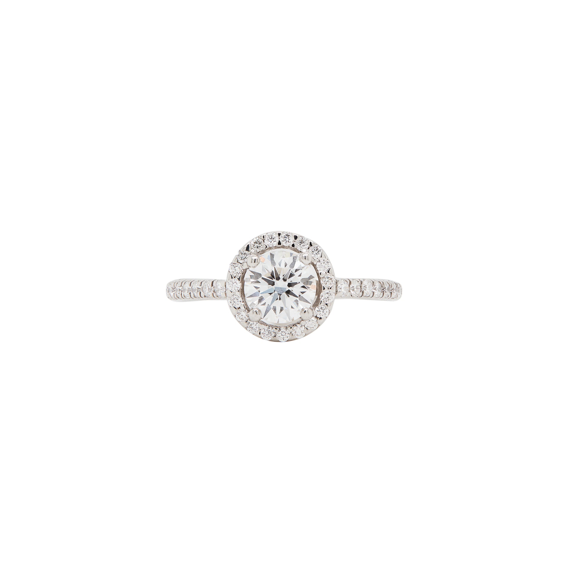 A round halo cluster engagement ring with a central diamond surrounded by a halo of smaller round brilliant cut diamonds, set in a platinum band.