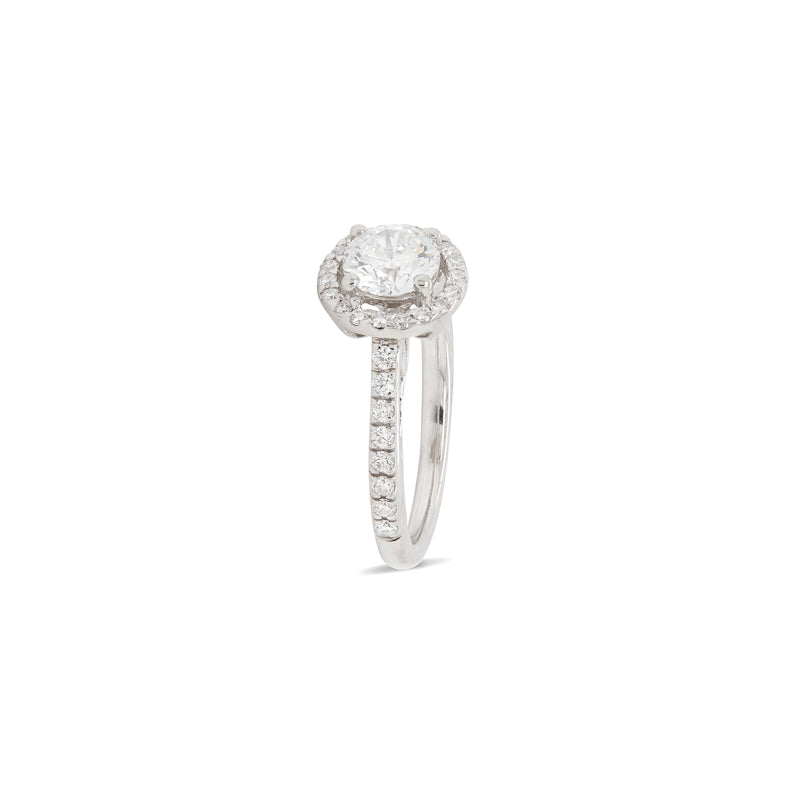 side of 0.70ct E VS1 diamond halo cluster engagement ring in platinum with round brilliant cut centre stone, halo and diamond shoulders,