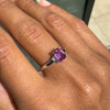 Ring with a pink gemstone on a person's finger