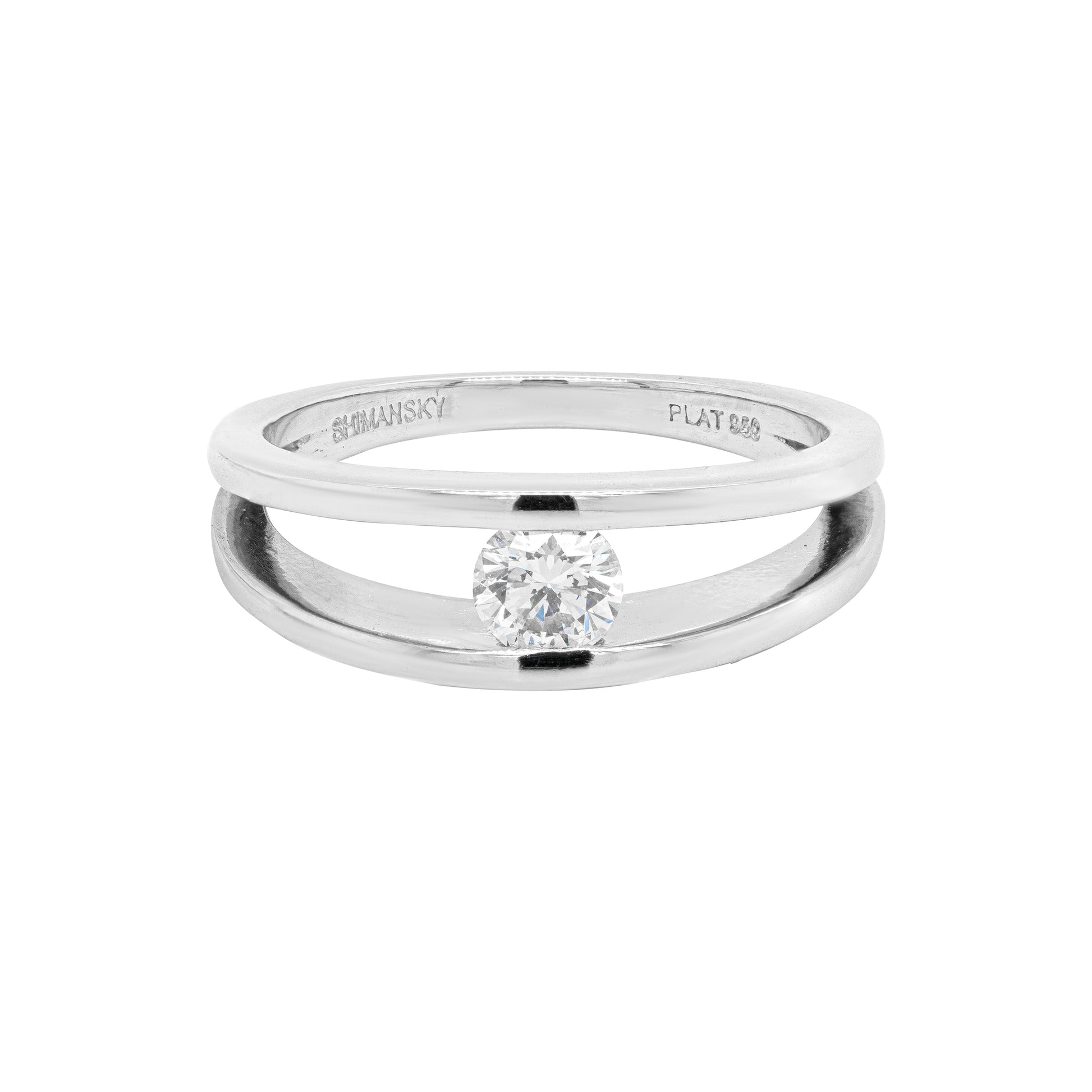 A  platinum engagement ring with a round brilliant cut diamond centerpiece, tension set design.