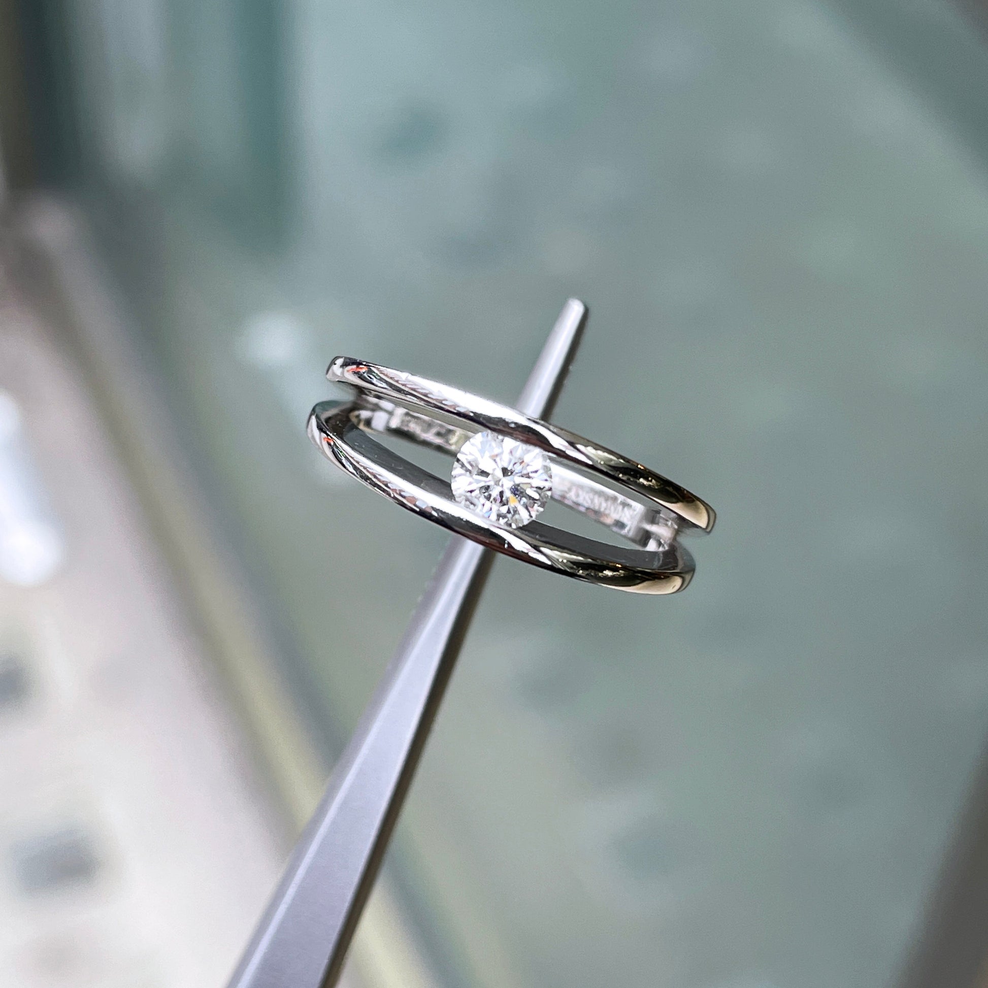 0.35ct F SI2 Round Brilliant Cut Tension Set Diamond Platinum Engagement Ring lifestyle 