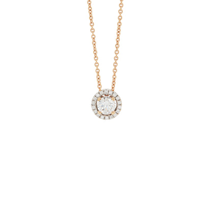 An 18 carat rose gold halo cluster pendant featuring a round brilliant cut diamond center stone with a halo of smaller round diamonds, suspended on a slender gold chain.