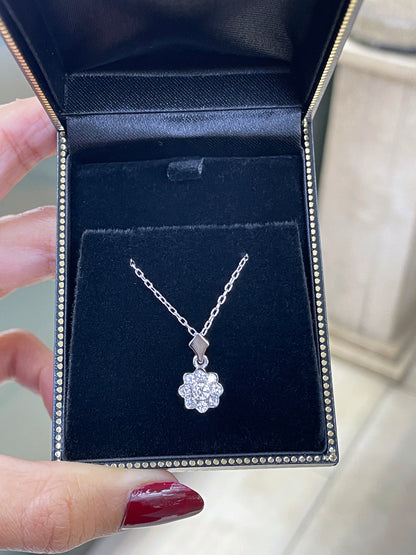0.45 carat diamond flower cluster pendant crafted in 18 carat white gold, round brilliant cut diamonds arranged in a floral design, suspended from a delicate white gold chain. in box