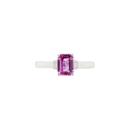 Ring with a pink sapphire gemstone on a white background