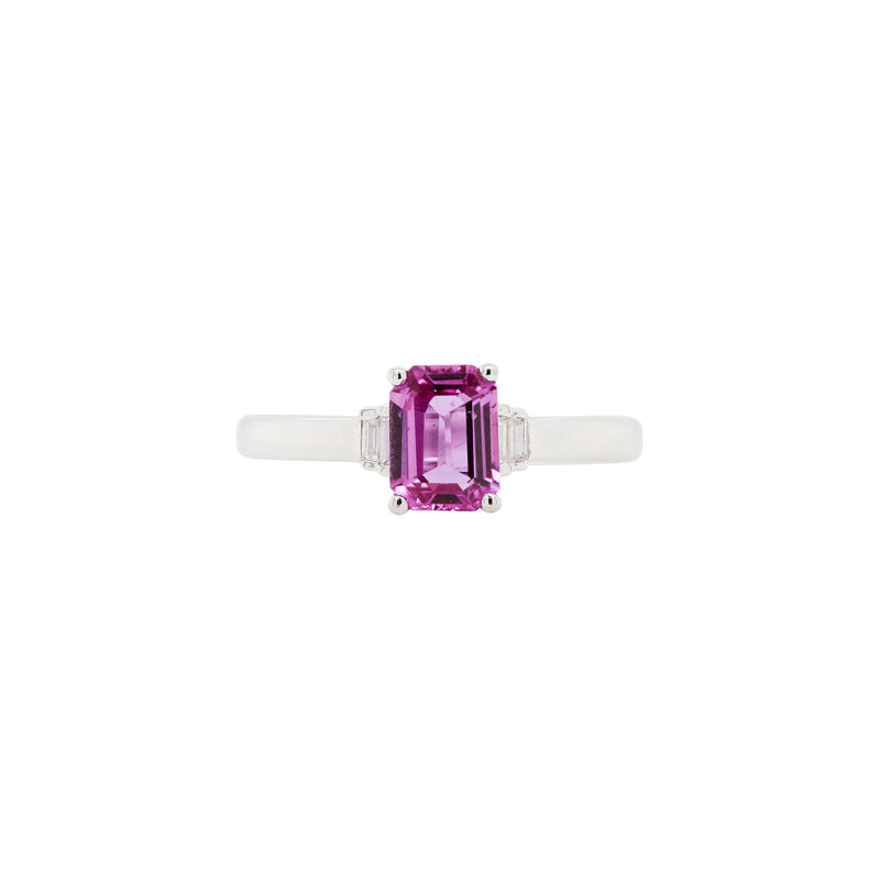 Ring with a pink sapphire gemstone on a white background