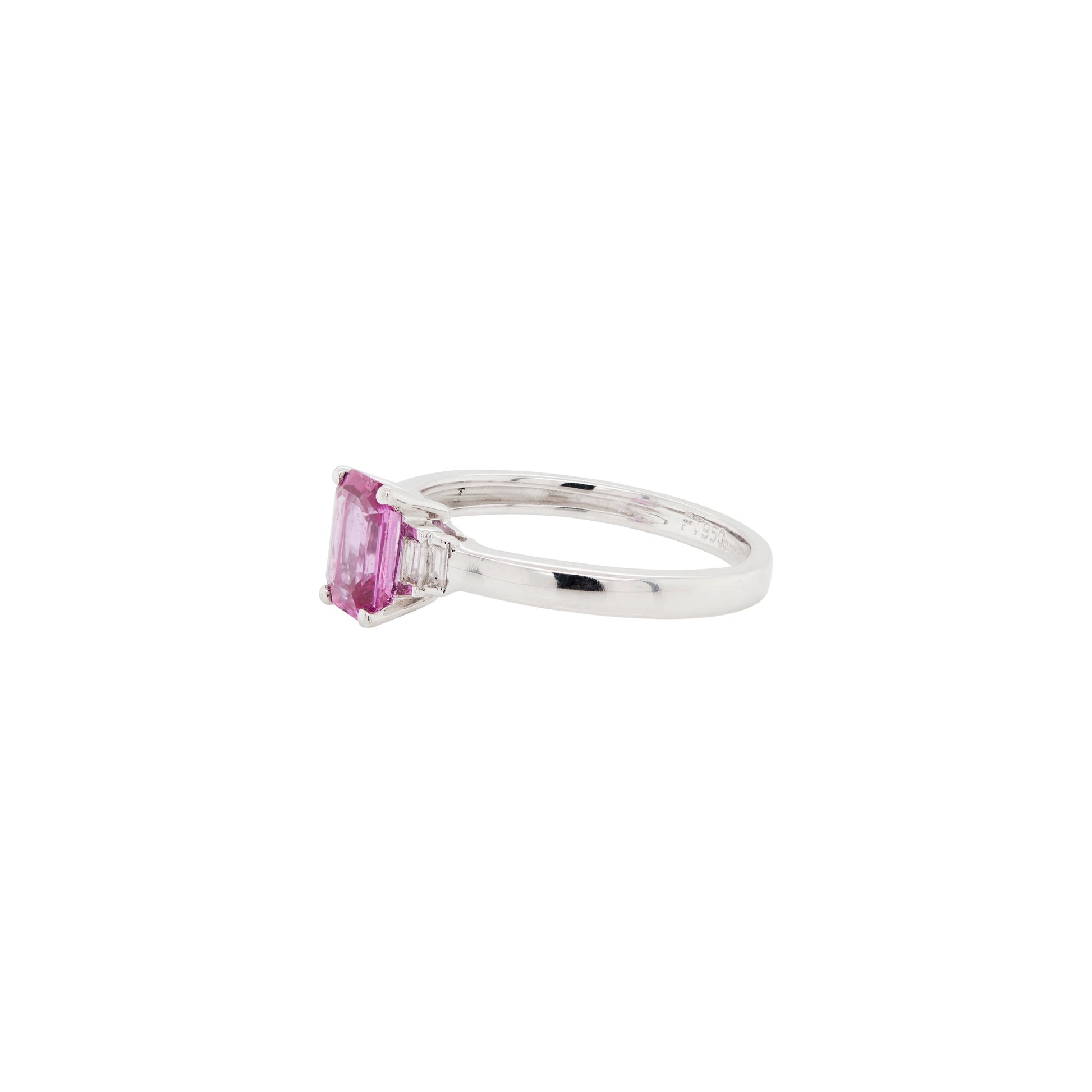 Silver ring with a pink sapphire on a white background
