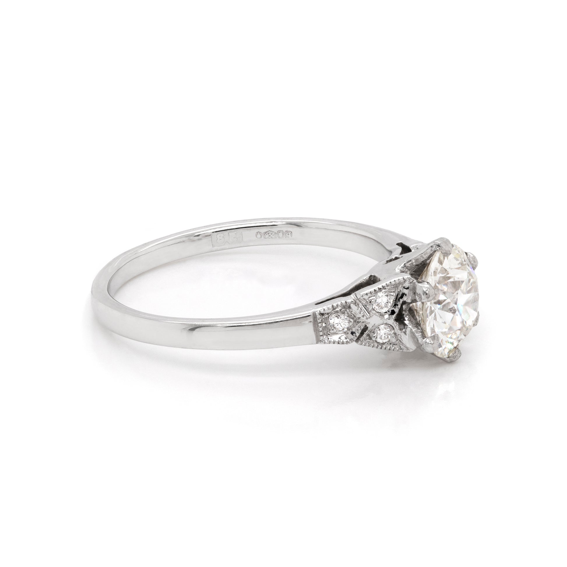 a 0.95 Carat Old Cut Diamond Engagement Ring with 6 smaller diamonds set in Platinum