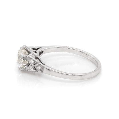 a 0.95 Carat Old Cut Diamond Engagement Ring with 6 smaller diamonds set in Platinum