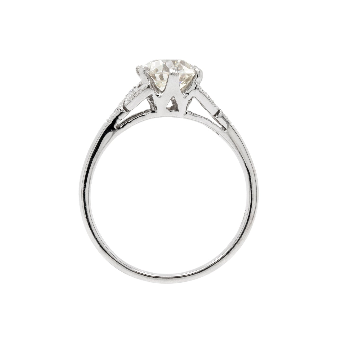 a 0.95 Carat Old Cut Diamond Engagement Ring with 6 smaller diamonds set in Platinum