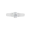 A white gold engagement ring with a round brilliant cut diamond centerpiece, set in a tapered platinum band.