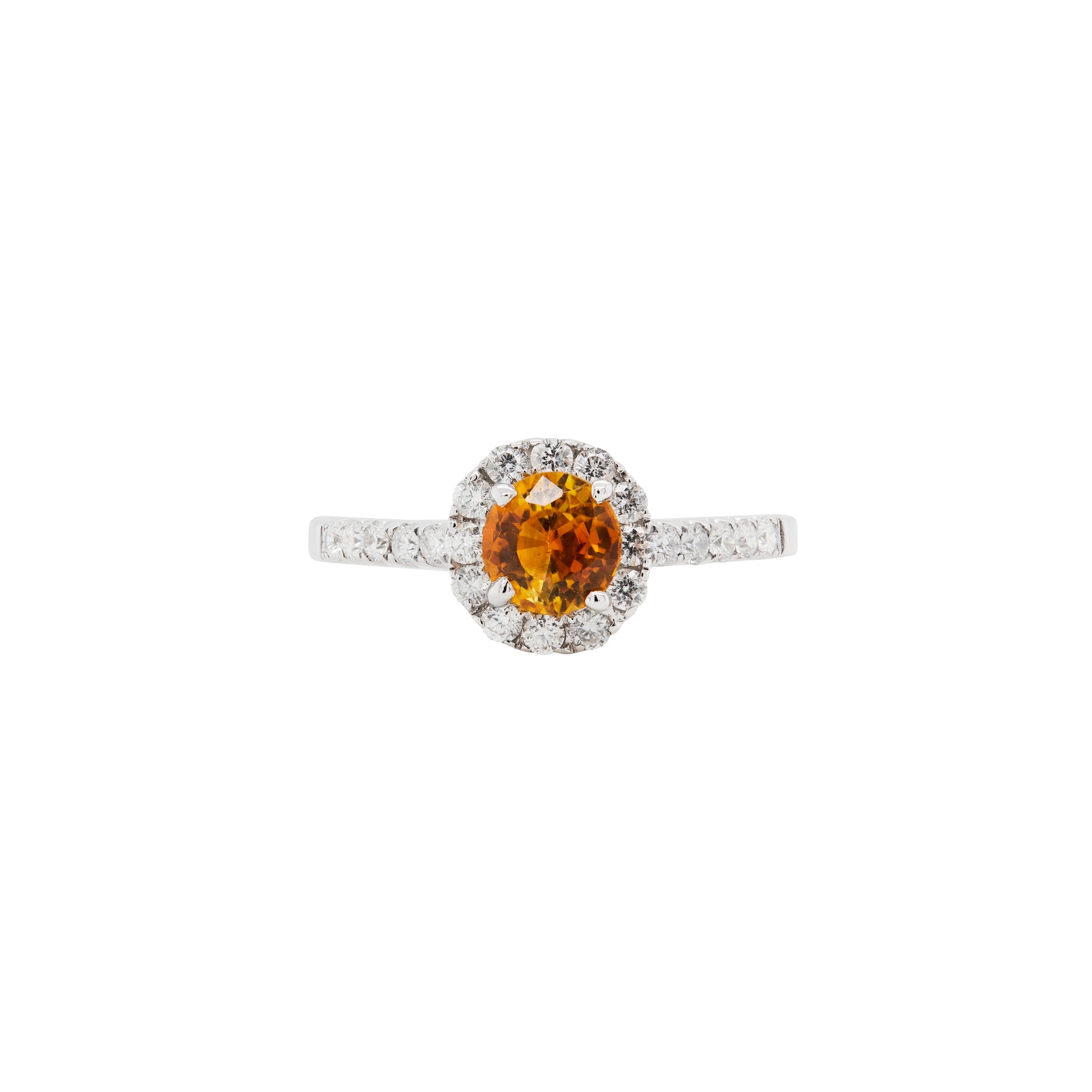An 18K white gold cluster engagement ring with a round orange sapphire center stone and a halo of round brilliant cut diamonds.