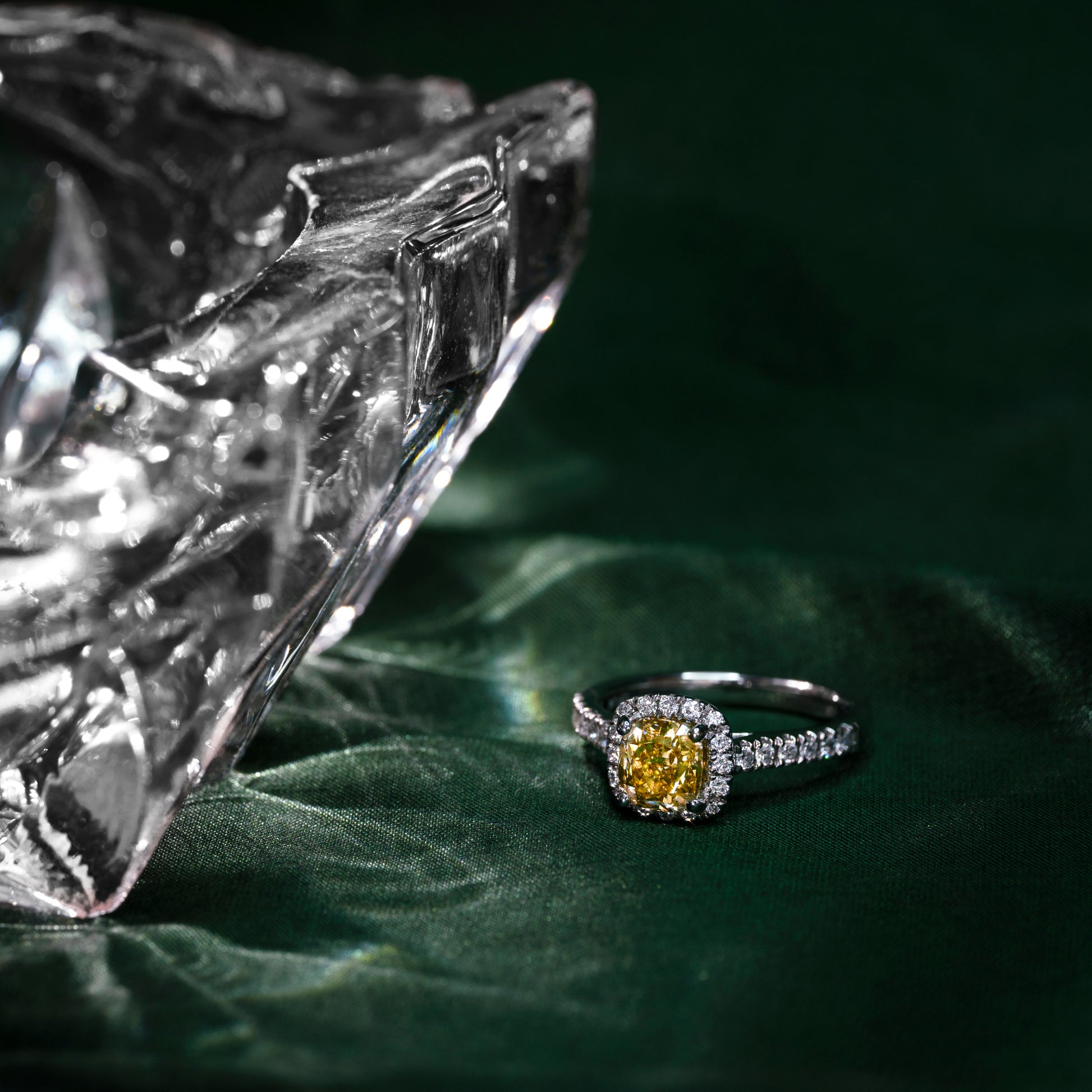 A champagne diamond engagement ring with white round brilliant cut diamonds set in a platinum band.