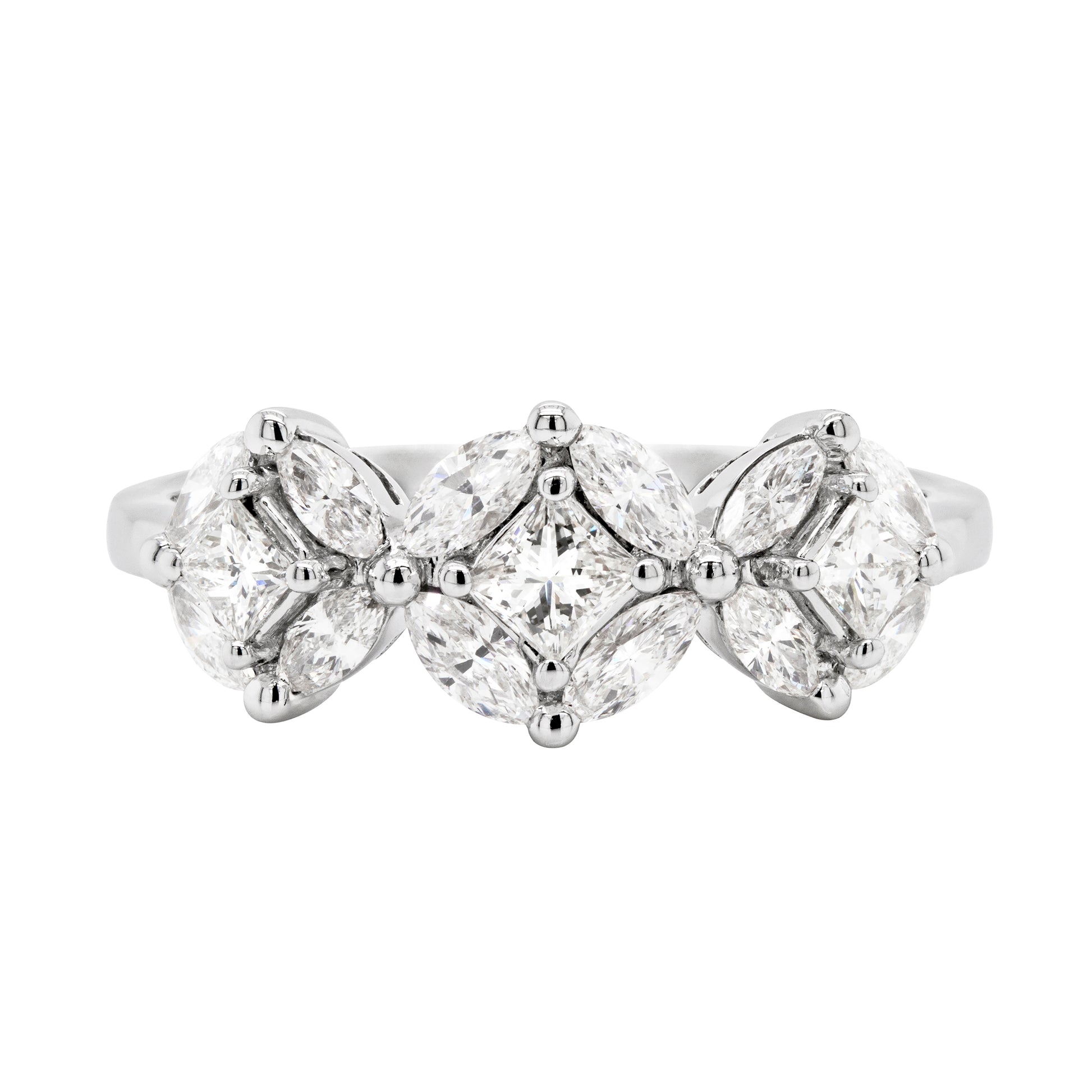 An 18 carat white gold trilogy diamond cluster engagement ring with three circular diamond clusters and a princess cut diamond in the center, set in a white gold band.