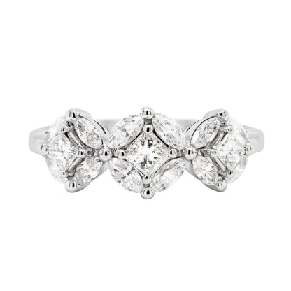 An 18 carat white gold trilogy diamond cluster engagement ring with three circular diamond clusters and a princess cut diamond in the center, set in a white gold band.