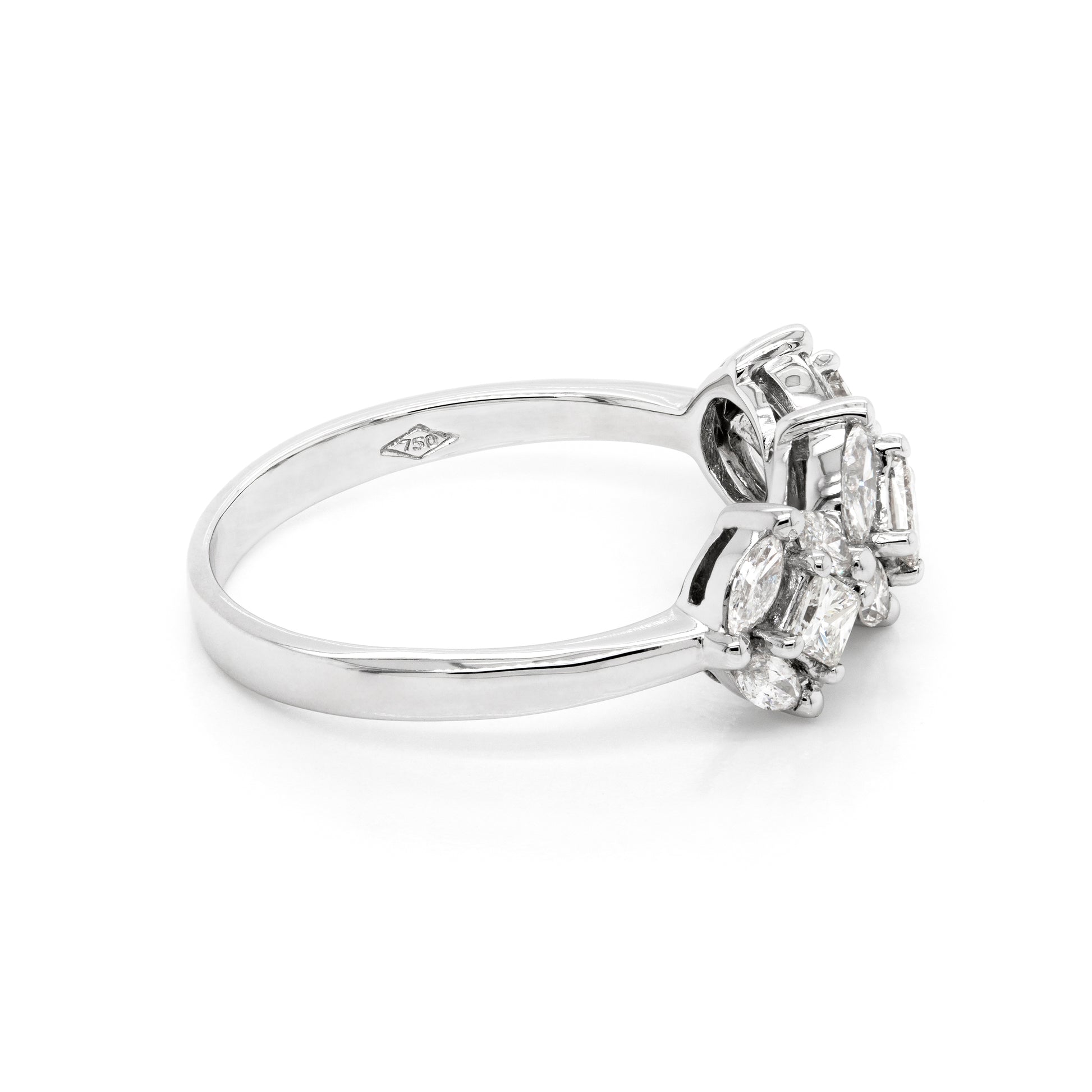 An 18 carat white gold trilogy diamond cluster engagement ring with three circular diamond clusters and a princess cut diamond in the center, set in a white gold band.