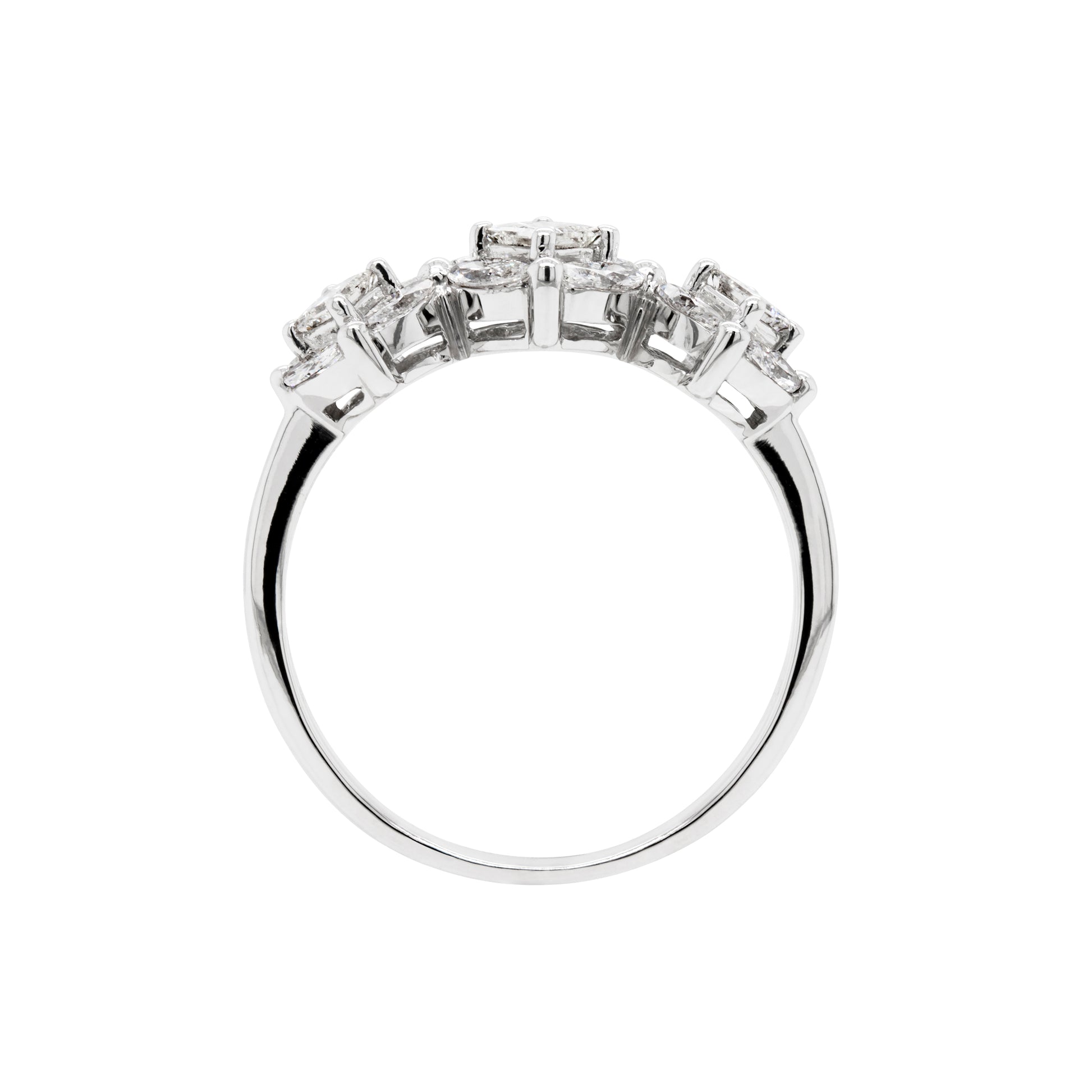 An 18 carat white gold trilogy diamond cluster engagement ring with three circular diamond clusters and a princess cut diamond in the center, set in a white gold band.
