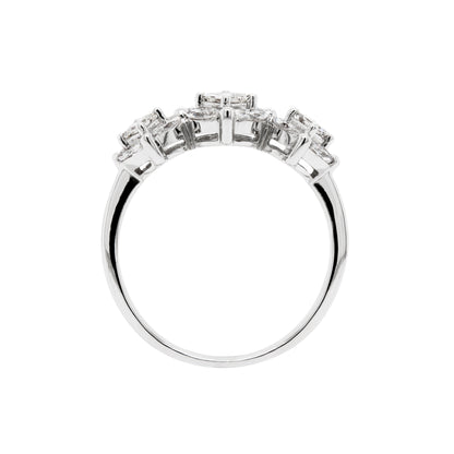 An 18 carat white gold trilogy diamond cluster engagement ring with three circular diamond clusters and a princess cut diamond in the center, set in a white gold band.