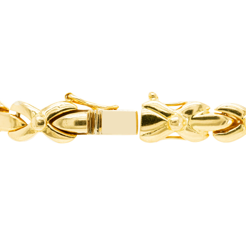 clasp of 18ct yellow gold bracelet with 1.25ct diamonds set in alternating ‘X’ and bar links.