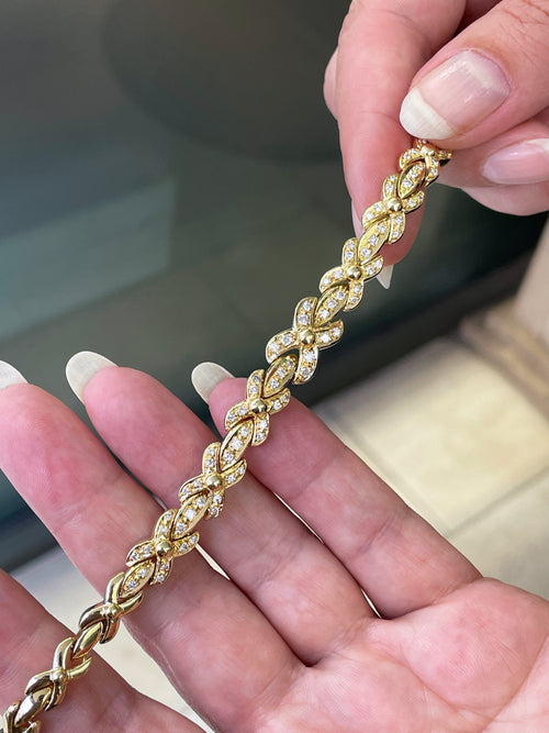 18ct yellow gold bracelet with 1.25ct diamonds set in alternating ‘X’ and bar links.