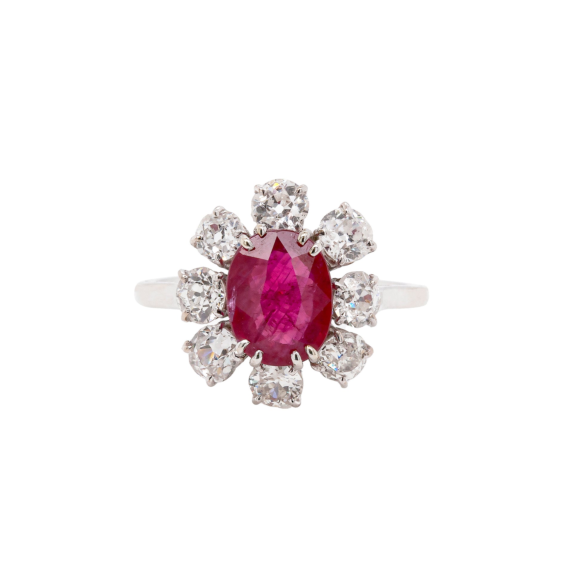 An 18ct white gold ruby and old cut diamond cluster engagement ring with French hallmarks.