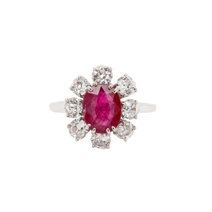 An 18ct white gold ruby and old cut diamond cluster engagement ring with French hallmarks.