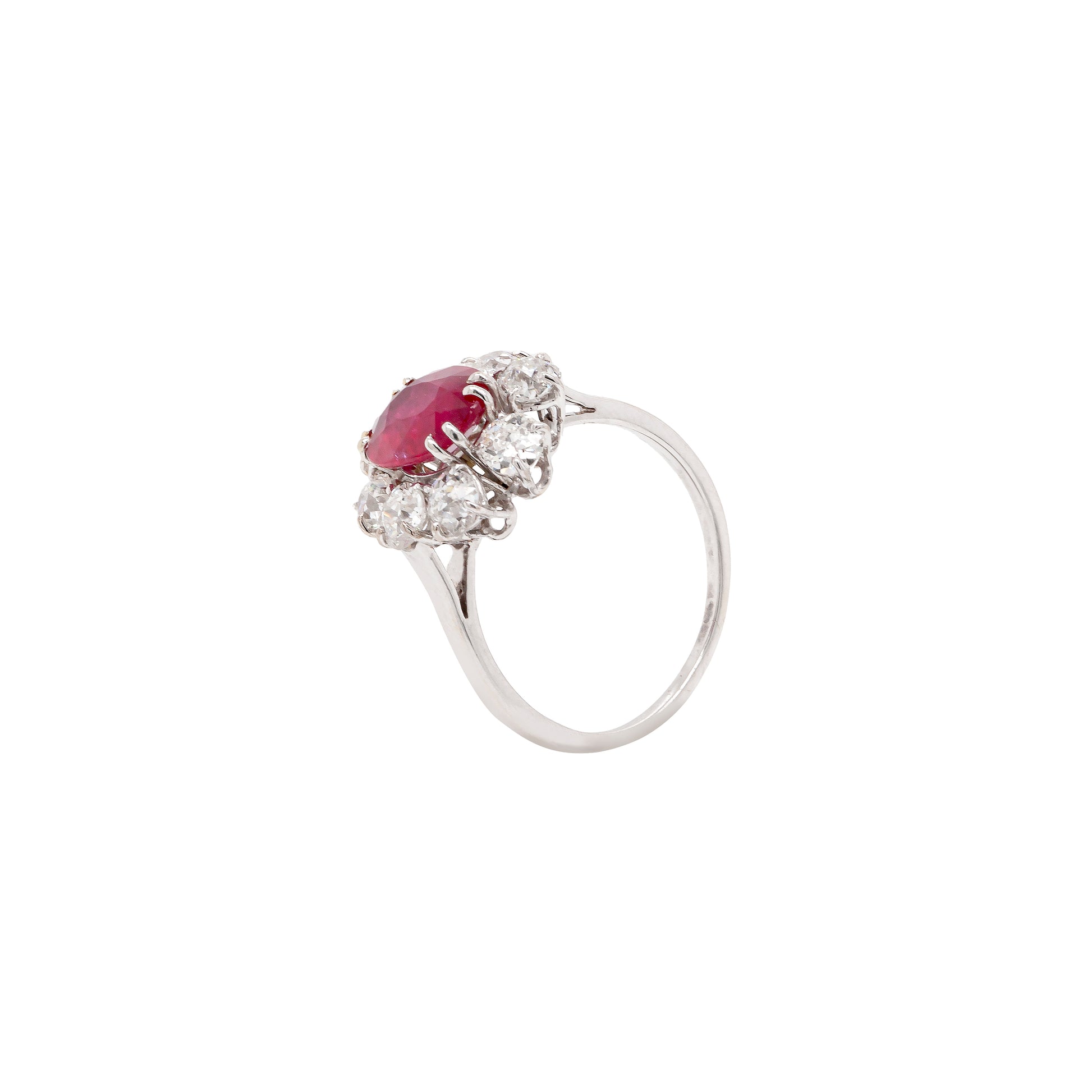 An 18ct white gold ruby and old cut diamond cluster engagement ring with French hallmarks.