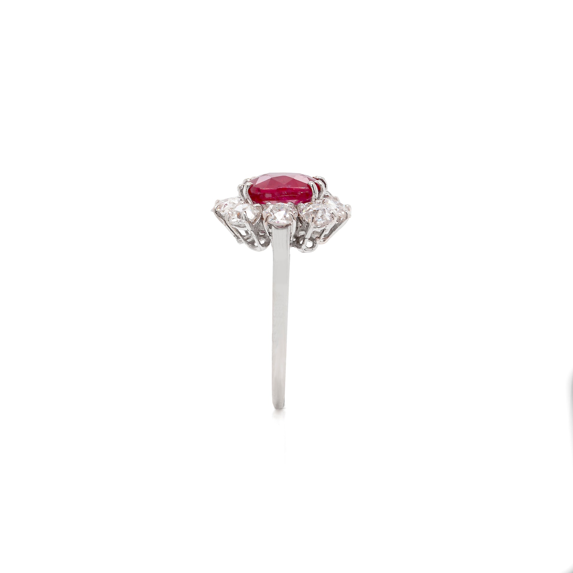 An 18ct white gold ruby and old cut diamond cluster engagement ring with French hallmarks.