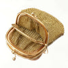 Gold mesh handbag on a white background